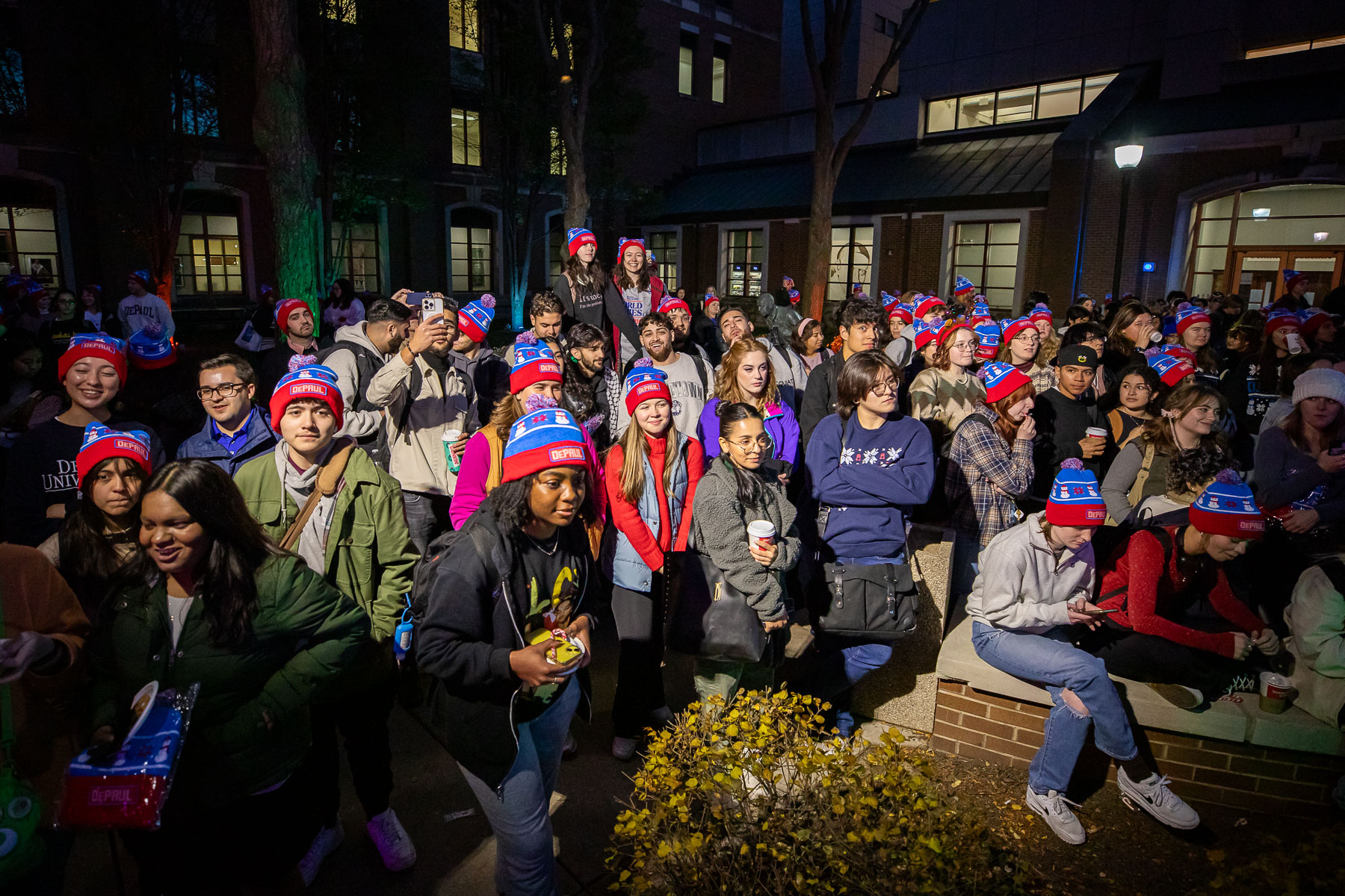 Students wait with bated breath for the lighting. (Photo by Jeff Carrion / DePaul University) 